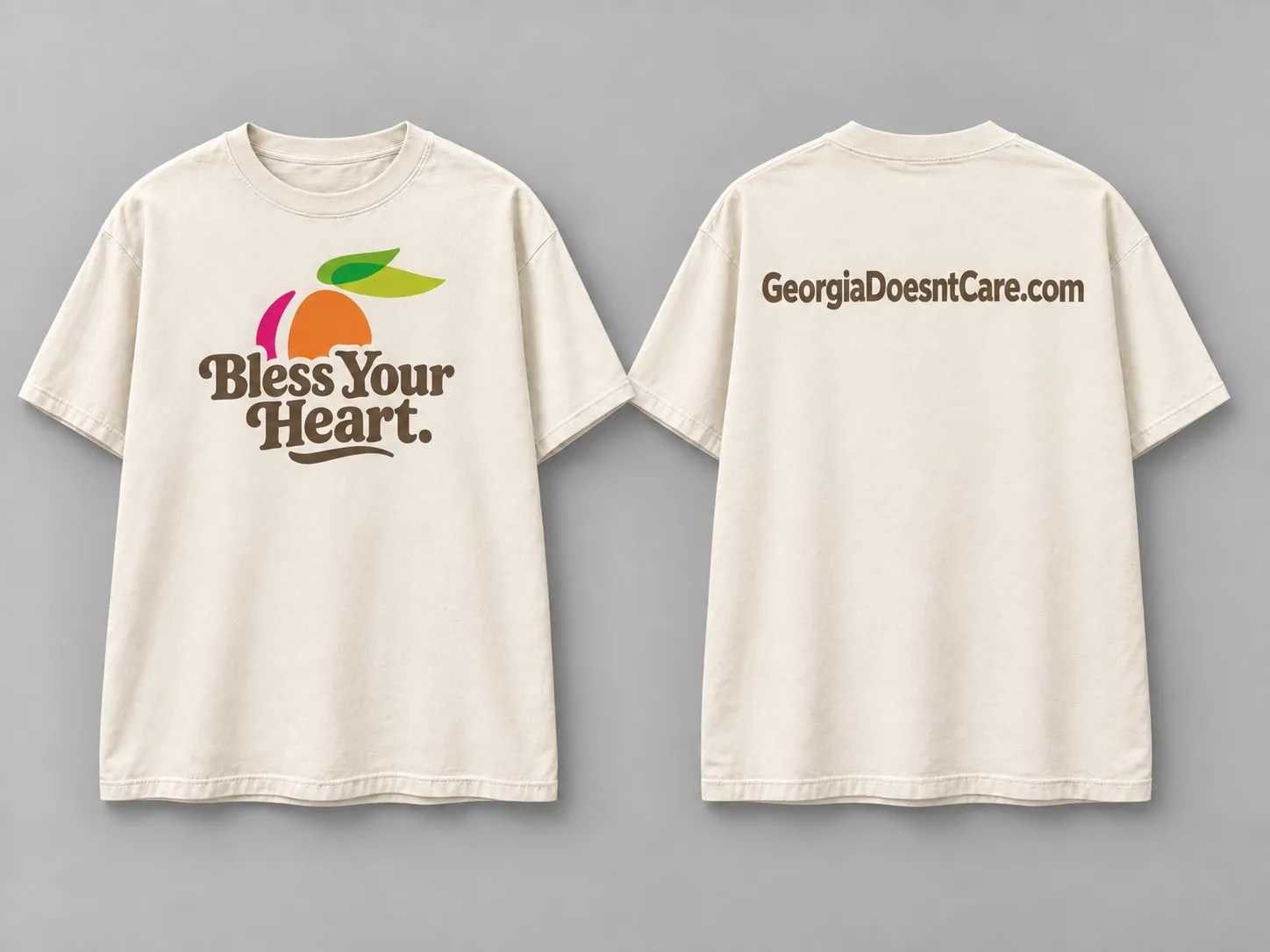 Cream peach tee mockup shown front and back: a peach behind compact chest lettering, with GeorgiaDoesntCare.com on the back.